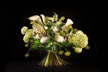 designer bouquet with white flowers on a black background