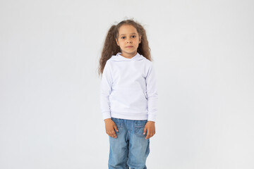 Little girl with two ponytails in a white hoodie. Mock-up.