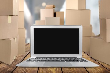 Laptop blank Screen for Infographics Displaying, Standing in Warehouse with boxes.