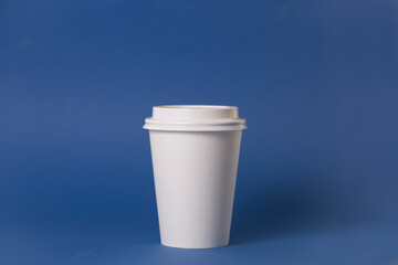 white coffee glass isolated on blue background