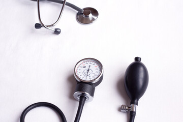 Stethoscope on white background, top view. Space for text