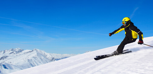 Skier in winter mountains