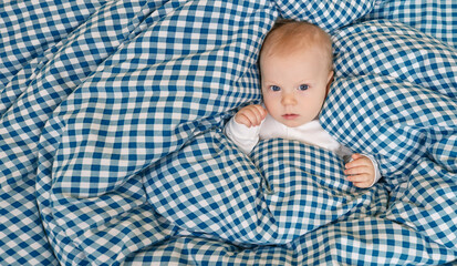 Portrait of a peaceful cute kid lying on the bed while sleeping. The correct daily routine for...