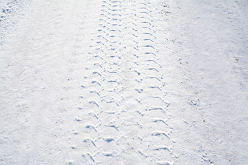 Car tire tracks on snow - Winter road with snow