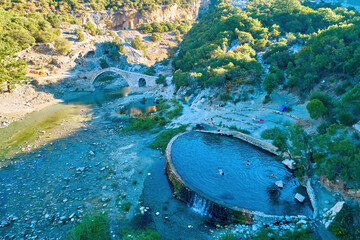 Aerial view of Thermal pools of Benjë,  near Përmet, National Park Hotova-Dangell, against the Nemërçka Mountains,  Gjirokastër.  Hot spot, traveling Albania. 