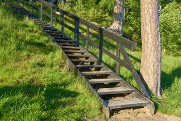 Wooden staircase leading up the hill.