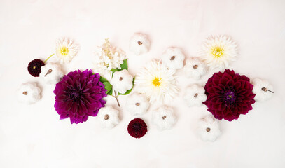 Fall arrangement with white pumpkins and purple fresh dahlia flowers