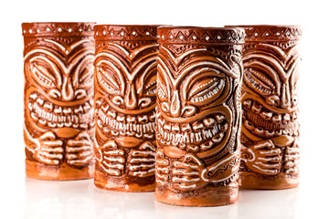 handmade ceramic mugs for mai tai cocktails isolated, tiki style glass
