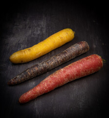 Multicolor carrots on grey background, France
