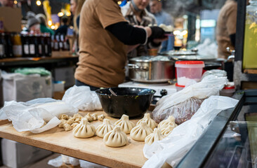Fresh Khinkali National Georgian Traditional cuisine cooked at street food market.