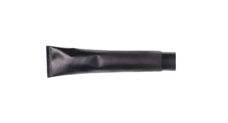 black tube with black toothpaste isolated on white background