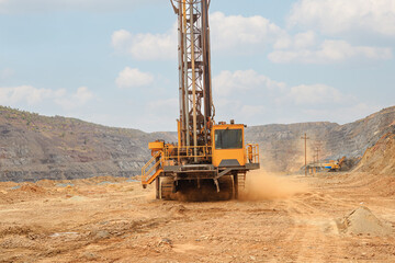 Machine for drilling wells in the quarry. Drilling of boreholes for laying an explosion in a quarry. Technologies of open-pit mining of minerals.