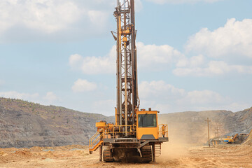 Machine for drilling wells in the quarry. Drilling of boreholes for laying an explosion in a quarry. Technologies of open-pit mining of minerals.