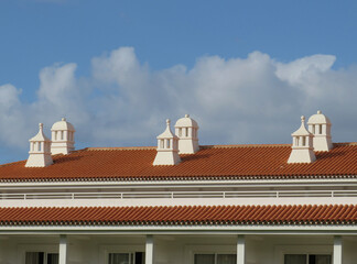 Beautiful white traditional chimneys on a roof in the South of Tenerife Island. Canary Islands....