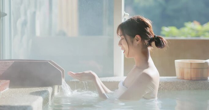 hand scoop up hot spring