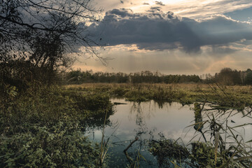 Sunset over a small river in late fall.