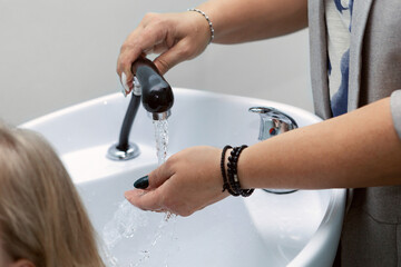 Obraz na płótnie Canvas White sink for washing hair in a barber shop.