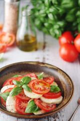 A bowl with traditional Italian caprese salad	
