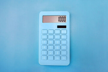 calculator on a blue background.