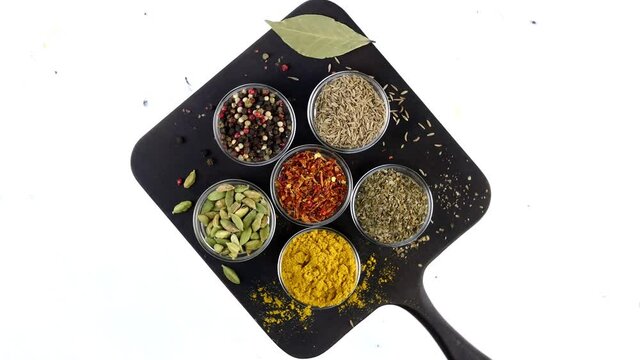 Different indian spices and herbs rotated.