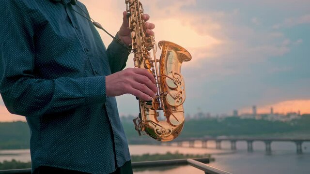 Musician playing saxophone on city house art sax jazz