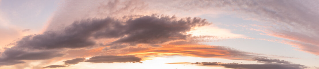 Fototapeta na wymiar Glowing sky at dusk on a fall evening. Banner, panoramic.