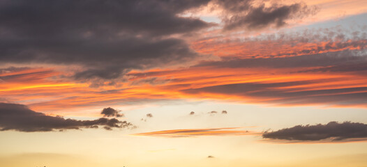 Glowing sky at dusk on a fall evening. Banner, panoramic.