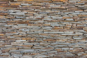 Wall made of irregular stones - background