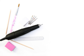 Fototapeta premium tools for manicure, nail care apparatus, wooden stick, nail file on white isolated background