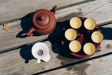 Tea ceremony, Woman pouring traditionally prepared tea