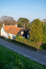 Walking in Scharendijke, small town in Zealand, Netherlands with old houses and blue water of Grevelingenmeer