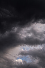 Epic dramatic Storm sky, dark grey and white cumulus clouds on blue sky background texture, thunderstorm