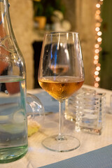 Summer on French Riviera Cote d'Azur, drinking cold rose from Cotes de Provence on outdoor terrase in old cafe, Var, France