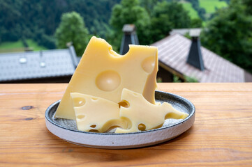 Cheese collection, French cow cheese emmental and french mountains village in Haute-Savoie on...