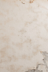Fototapeta premium Blurred image of old paper glued on a concrete wall.