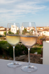 Summer on French Riviera Cote d'Azur, drinking cold rose and white wine from Cotes de Provence on outdoor terrase in Port Grimaud, Var, France