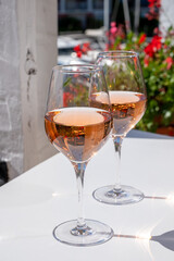 Summer on French Riviera Cote d'Azur, drinking cold rose wine from Cotes de Provence on outdoor terrase in Port Grimaud, Var, France