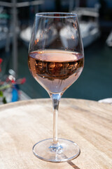 Summer on French Riviera Cote d'Azur, drinking cold rose wine from Cotes de Provence on outdoor terrase in Port Grimaud, Var, France