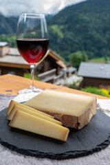 Cheese collection, French cow cheese comte, beaufort, abondance, red wine from Savoie and french...