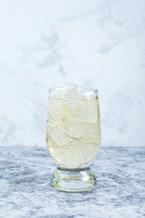 Refreshing carbonated cocktail with ice. Melon lemonade. Soft drink in tall glass