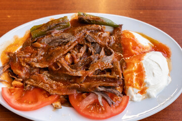 Iskender kebab, or Iskender Doner, a famous Turkish kebab dish originates in Bursa region in Turkey. Turkish cuisine photo
