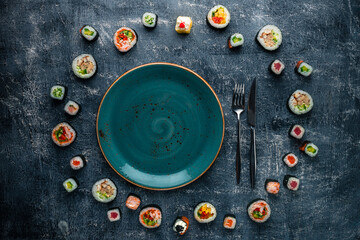 Set of traditional japanese food on a dark background. Sushi rolls Asian food frame.