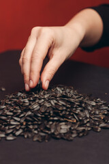 natural product sunflower seeds handing close-up food