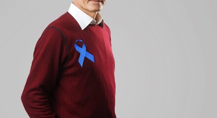 November Prostate Cancer Awareness month, Man with Blue Ribbon for supporting people