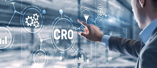 Conversion Rate Optimization. CRO Technology Finance concept Businessman pressing on a virtual screen