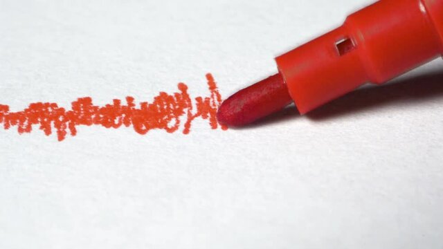 Red pen draws on white page frequency, seismogram