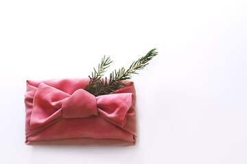 Box gift wrapped in red fabric