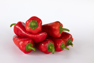 pile of red peppers isolated on white background