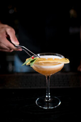 bartender pounding cocktail