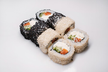 Sushi set with salmon, tuna and cream cheese. Traditional Japanese cuisine.